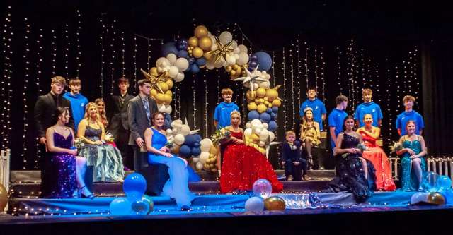 ALTON, MO – JANUARY 30: The 2024 Alton Homecoming Court on the stage (left to right): Abigail Kirkpatrick, Kagen Hollis, Mollie Warren, Kade Clary, Miley Haney, Thomas Bettis, Rydan Deckard, McKenzie Smith, Jacob Ruddy, Renee Nash (Homecoming Queen), Easton Alford (crown bearer), Danielle Garlow, Jaiden Sisco, Marcus Cockrum, Jennah Holman, Jaylee Reese, Dalton Poulette, Gracetyn Warren, Dillon Weyland during the high school basketball game between the Alton Comets and the Koshkonong Blue Jays on January 30, 2024, at the Alton High School Gym in Alton, Missouri. (Photo by Amanda Thomas/AltonMo.com)