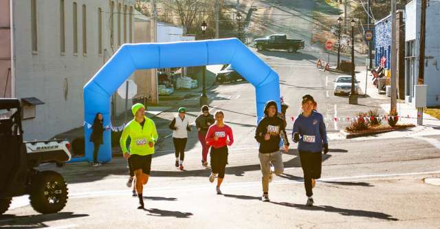 The "Running into the New Year" 5K participants starting the race.