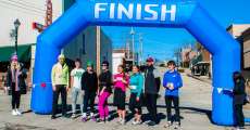 All the 5K runners pose for a picture at the finish line.