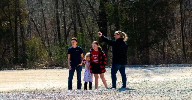 People cheering on the Couch Indians as they head to the district championship game.