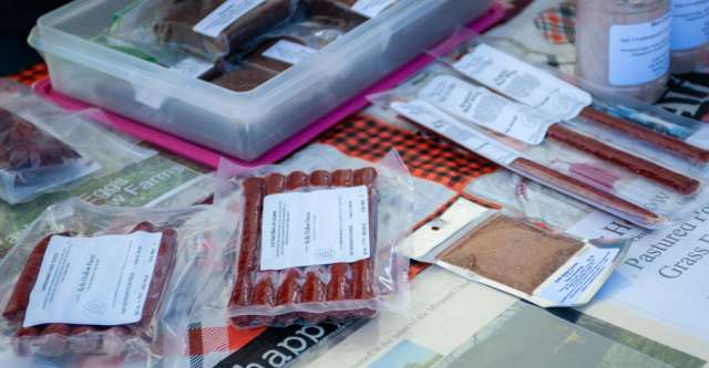 Meat, jerky, and hot cocoa at one of the vendor tables at the Oregon County Farmer's Market.
