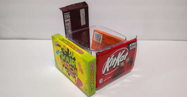The boxes of candy on the side of the container.