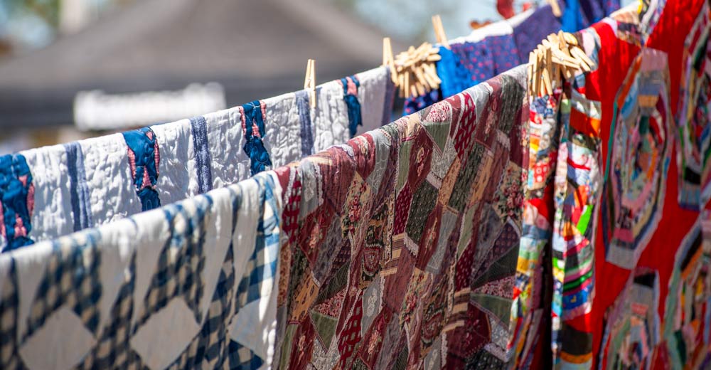 Quilts hanged up to be judged.