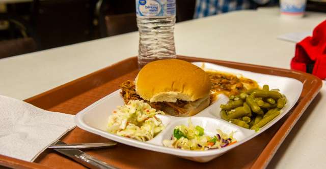 Pulled pork with sides and a drink.