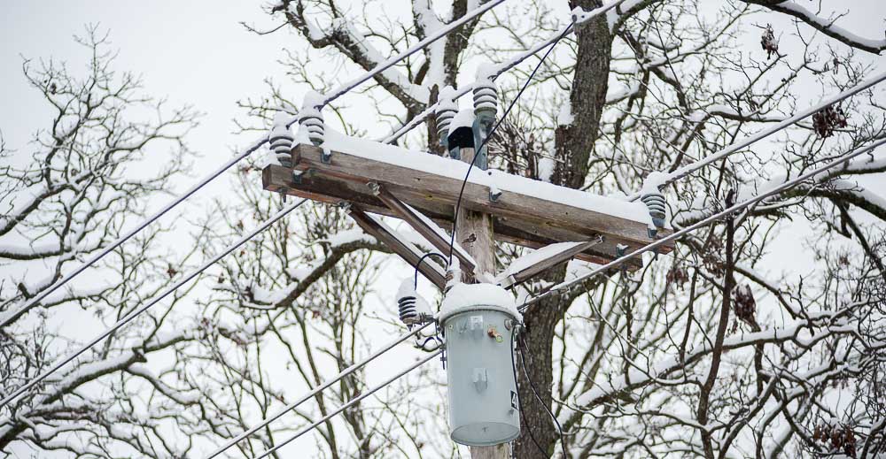 Power lines with snow on them.