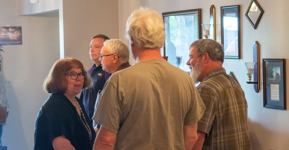 People talking together after the National Day of Prayer service.