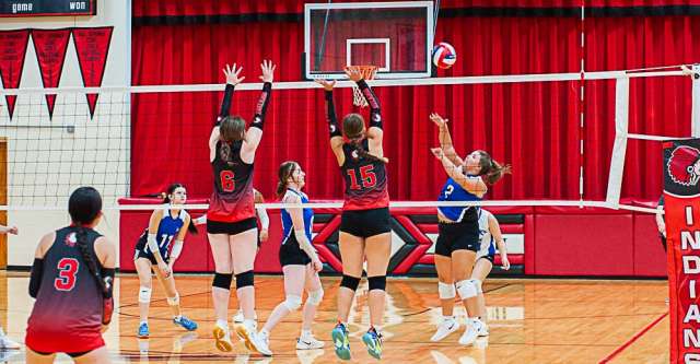 COUCH, MO – SEPTEMBER 8: Couch Indians Madison DuBois (15) and Miley Hampton (6) block the ball after a spike during the high school volleyball game between the Couch Indians and the Koshkonong Blue Jays on September 8, 2025, at the Couch High School Gym in Couch, Missouri. (Photo by Amanda Thomas/AltonMo.com)