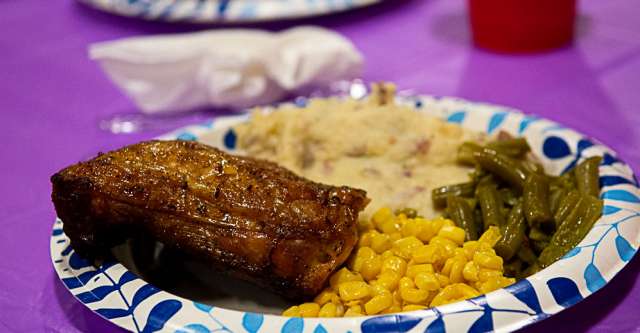 The fundraiser meal of chicken, corn, green beans, and potatoes.