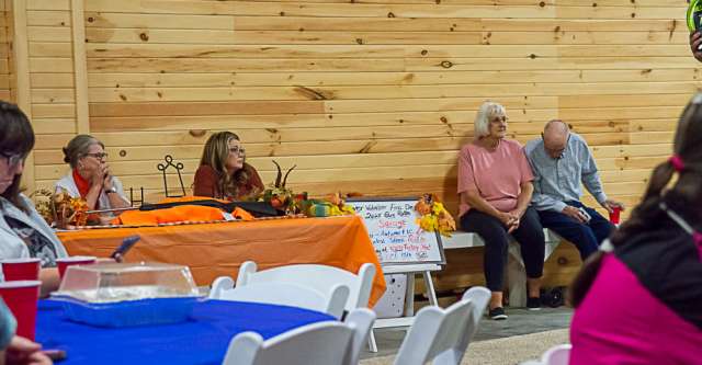 People listening to the auction going on.