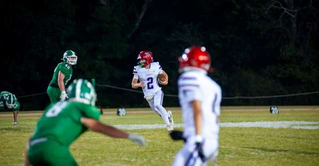 THAYER, MO – SEPTEMBER 12: Liberty Eagles quarterback Parker Tune (2) sprints past the defense during the high school football game between the Thayer Bobcats and the Liberty (Mtn. View) Eagles on September 12, 2025, at the Thayer High School football field in Thayer, MO. (Photo by Curtis Thomas/AltonMo.com)