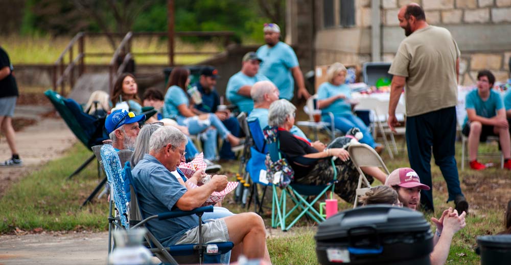 People sitting and listening to Dawson Hollow.