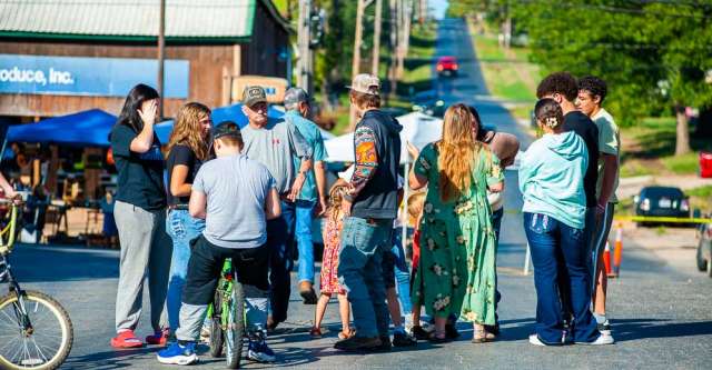 A group of people talking together at the Walnut Festival.