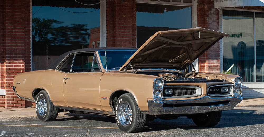 A gold car at the classic car cruise-in on Friday.