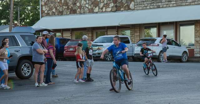 The one-mile bicycle racers near the finish line.