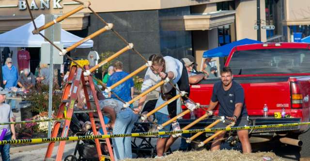 A teenager attempting the ladder climbing game