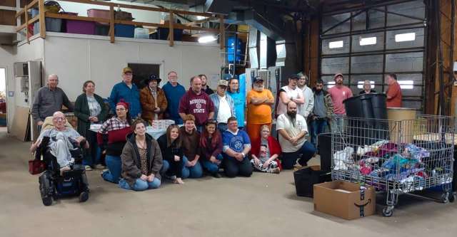The workers, Board of Directors of the Oregon County Sheltered Workshop, as well as Herman Holmes, posing for a group photo.