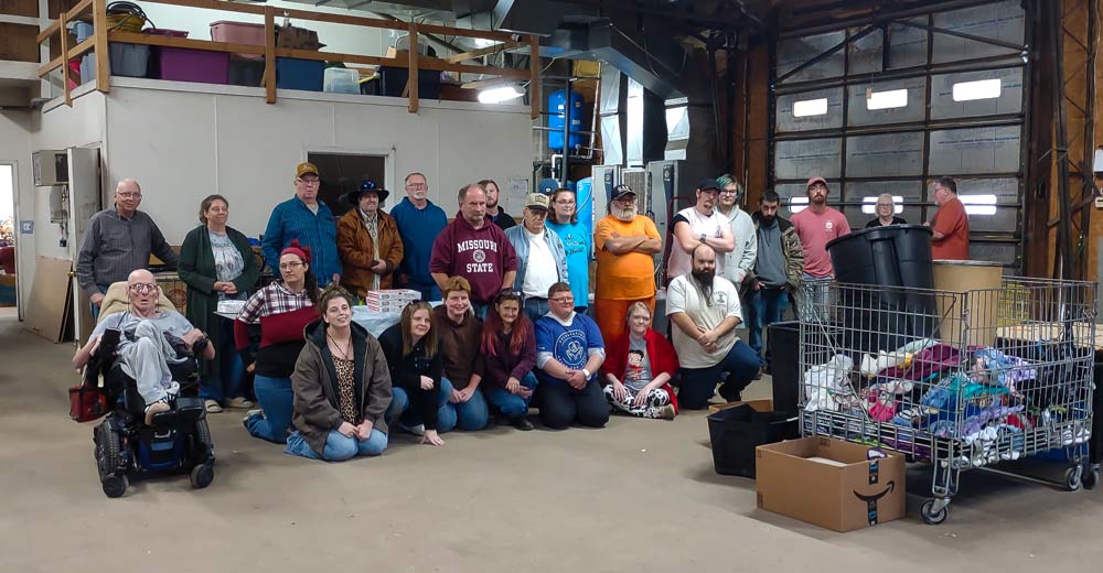 The workers, Board of Directors of the Oregon County Sheltered Workshop, as well as Herman Holmes, posing for a group photo.