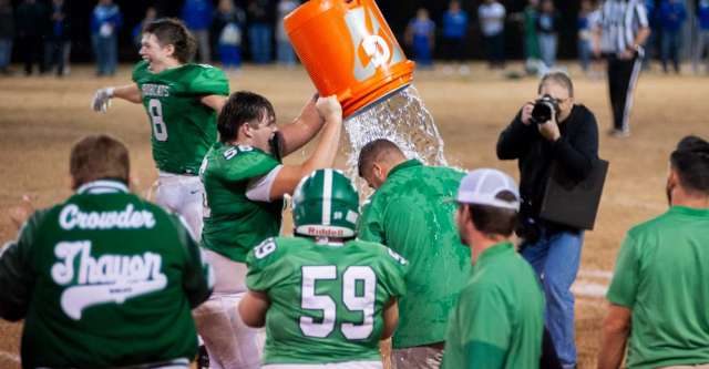 THAYER, MO – NOVEMBER 14: Thayer Bobcats player dumps water on the head coach in celebration after the high school football game between the Thayer Bobcats and the Marionville Comets on November 14, 2025, at the Thayer High School football field in Thayer, MO. (Photo by Curtis Thomas/AltonMo.com)