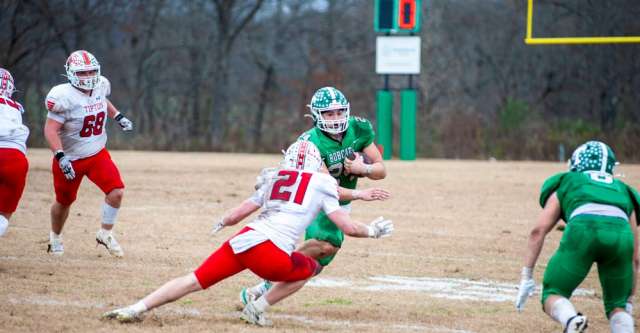 THAYER, MO – NOVEMBER 22: Thayer Bobcats running back Dominick Boyce (24) scrambles around a Tipton defender during the high school football game between the Thayer Bobcats and the Tipton Cardinals on November 22, 2025, at the Thayer High School football field in Thayer, MO. (Photo by Curtis Thomas/AltonMo.com)