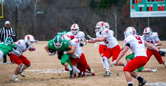 THAYER, MO – NOVEMBER 22: Thayer Bobcats running back Thomas Poole (8) gets tackled by the defense during the high school football game between the Thayer Bobcats and the Tipton Cardinals on November 22, 2025, at the Thayer High School football field in Thayer, MO. (Photo by Curtis Thomas/AltonMo.com)