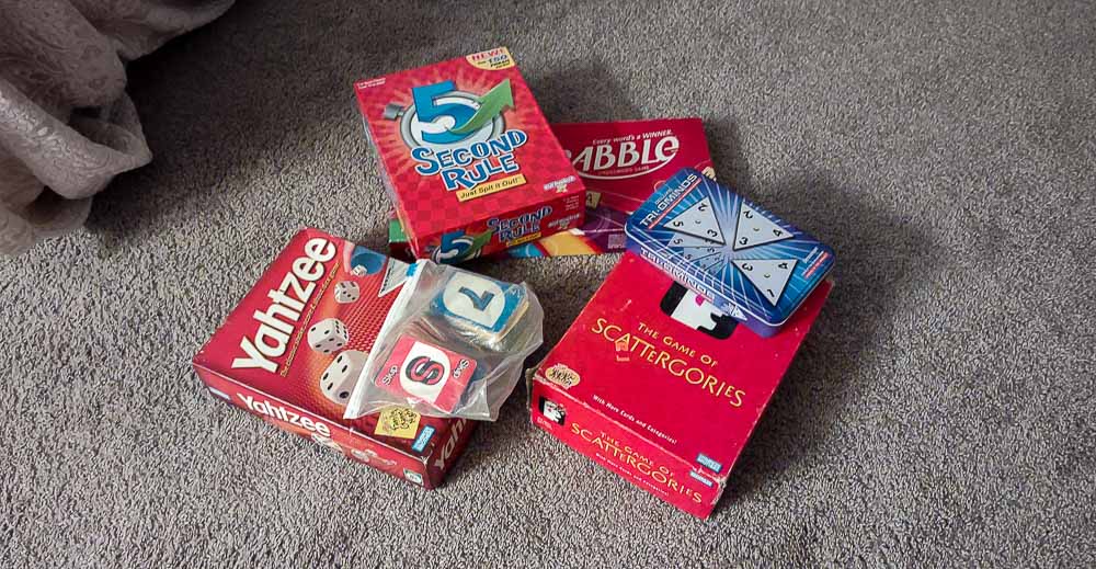 Board games in a pile.