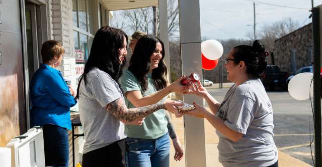Iron Brand realtors handing out hot dogs and soda.