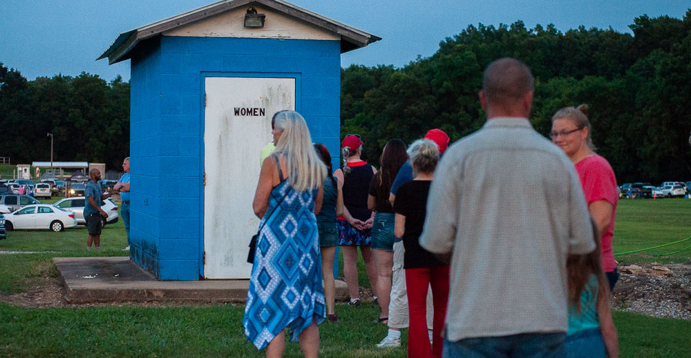 long line for porta potties