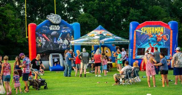 Bouncy houses lined up for the kids at Thayer's celebration.