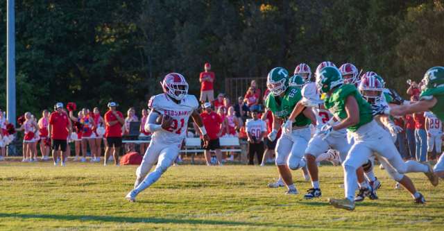 THAYER, MO – AUGUST 28: Pocahontas Redskin Xayver Ballard (21) eyes an opening in the defense during the high school football game between the Thayer Bobcats and the Pocahontas Redskins on August 28, 2026, at the Thayer High School football field in Thayer, MO. (Photo by Curtis Thomas/AltonMo.com)