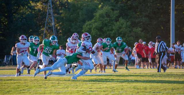 THAYER, MO – AUGUST 28: Pocahontas Redskin Xayver Ballard (21) tries to break out of a tackle during the high school football game between the Thayer Bobcats and the Pocahontas Redskins on August 28, 2026, at the Thayer High School football field in Thayer, MO. (Photo by Curtis Thomas/AltonMo.com)