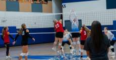 ALTON, MO – SEPTEMBER 15: Dora Falcons Ellie Ullom (22) spikes the ball over the net during the high school volleyball game between the Alton Comets and the Dora Falcons on September 15, 2026, at the Alton High School Gym in Alton, Missouri. (Photo by Amanda Thomas/AltonMo.com)