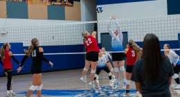 ALTON, MO – SEPTEMBER 15: Dora Falcons Ellie Ullom (22) spikes the ball over the net during the high school volleyball game between the Alton Comets and the Dora Falcons on September 15, 2026, at the Alton High School Gym in Alton, Missouri. (Photo by Amanda Thomas/AltonMo.com)