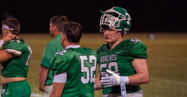 THAYER, MO – SEPTEMBER 18: Thayer Bobcats offensive linemen Ty Young (52) and Canyon Harper (58) talk during a break during the high school football game between the Thayer Bobcats and the Salem Tigers on September 18, 2026, at the Thayer High School football field in Thayer, MO. (Photo by Curtis Thomas/AltonMo.com)