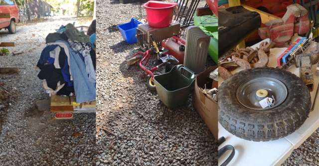 Clothes, bike, and wheel for a yard sale.