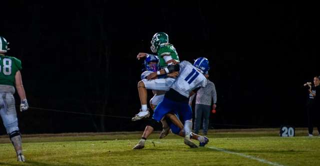 THAYER, MO – OCTOBER 2: Cabool Bulldog Briley Honeycutt (11) picks up the quarterback in a tackle during the high school football game between the Thayer Bobcats and the Cabool Bulldogs on October 2, 2026, at the Thayer High School football field in Thayer, MO. (Photo by Amanda Thomas/AltonMo.com)