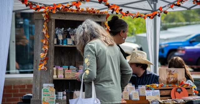A women shops at the various booths at the Walnut Festival.
